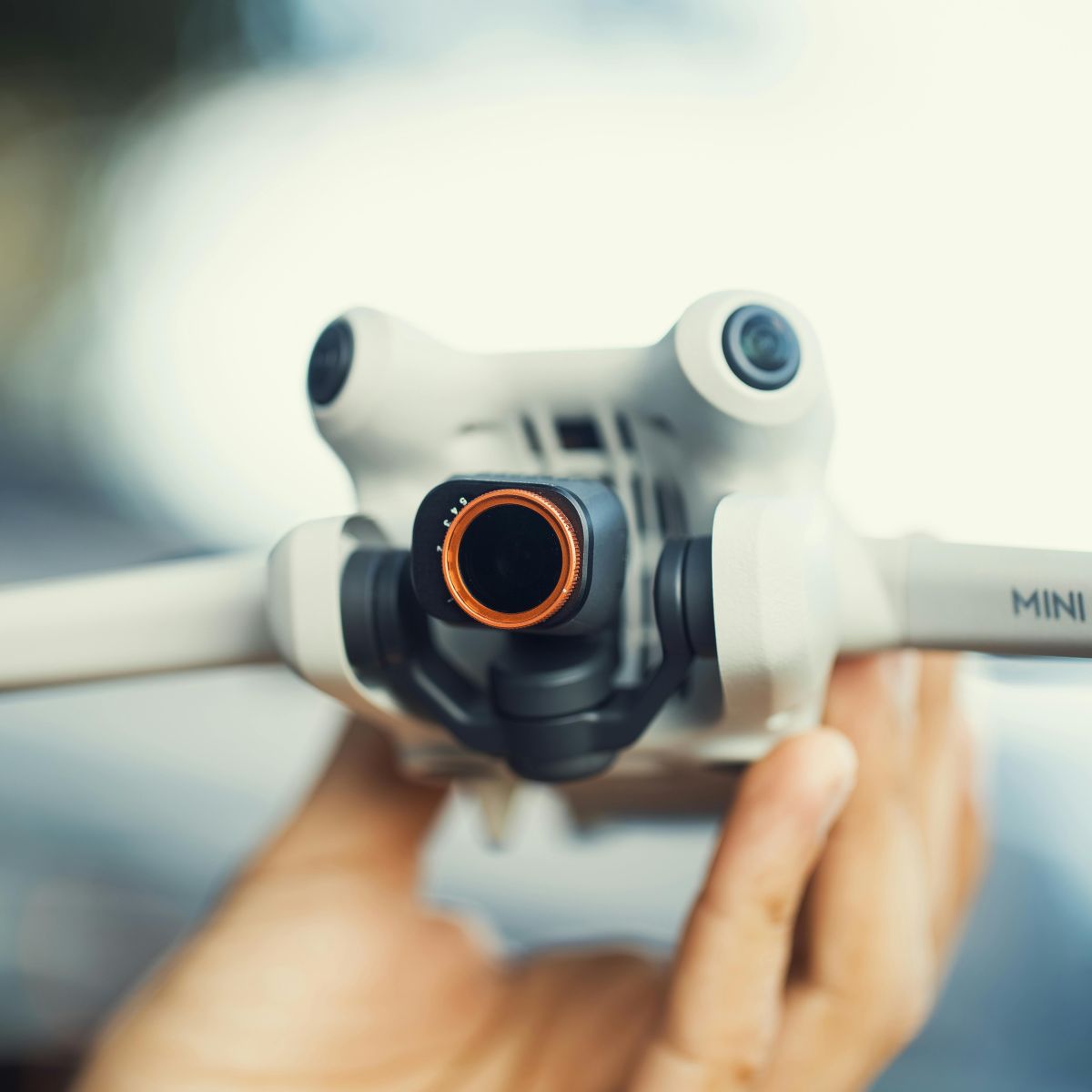 Hands holding a drone